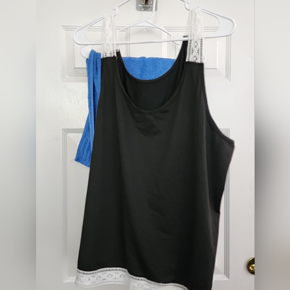 Black tank top with white lace on straps and bottom of shirt size 22